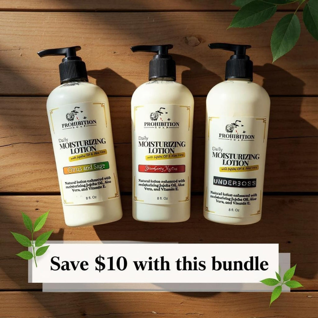 Prohibition Soap Scented Lotion Bundle featuring three Daily Moisturizing Lotions - Citrus and Sage, Strawberry Martini, and Underboss (all 8 fl oz) - arranged on rustic wood background with green leaves and 'Save $10 with this bundle' text overlay