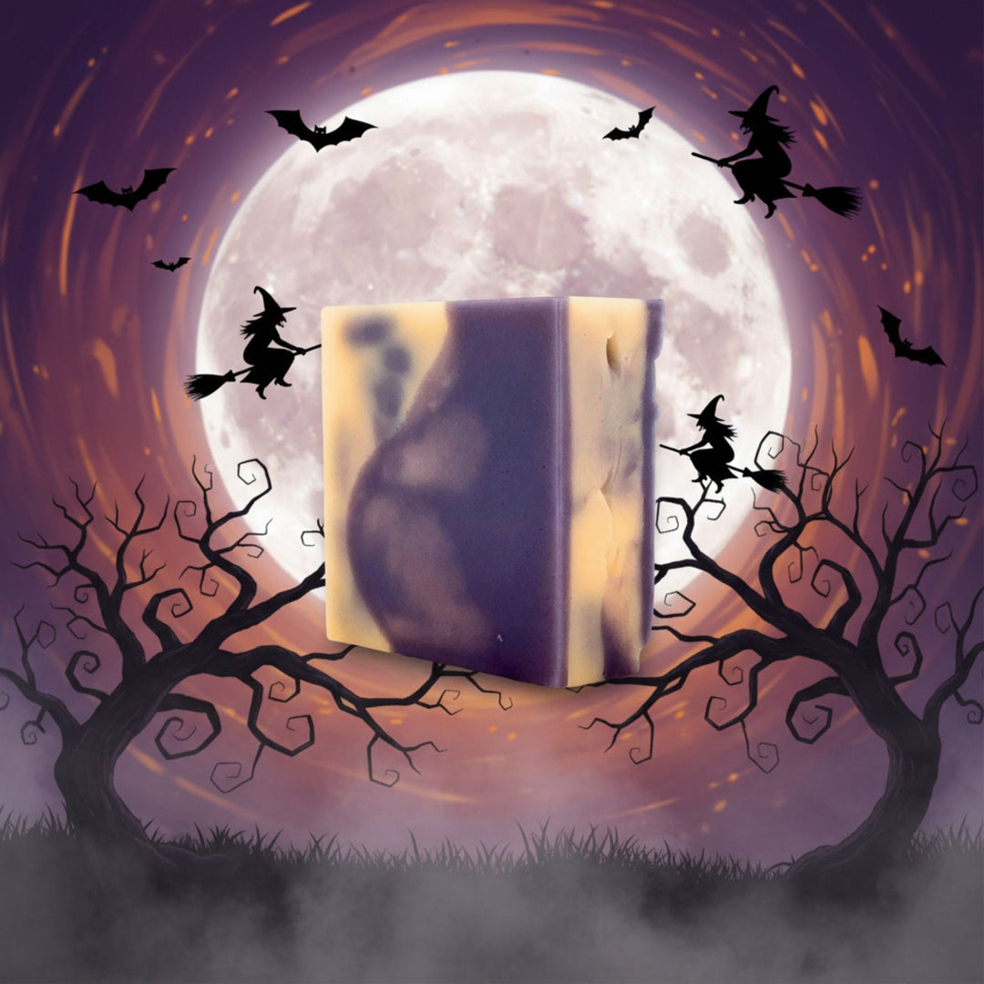 Halloween-themed illustration with open book, full moon, and witches on brooms.