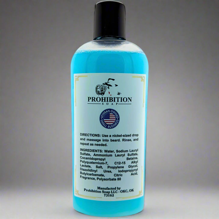 Prohibition Soap Barbershop Beard Wash back label showing directions, complete ingredients list including water, sodium lauryl sulfate, and cocamidopropyl betaine, with Made in USA badge on clear bottle containing blue wash liquid