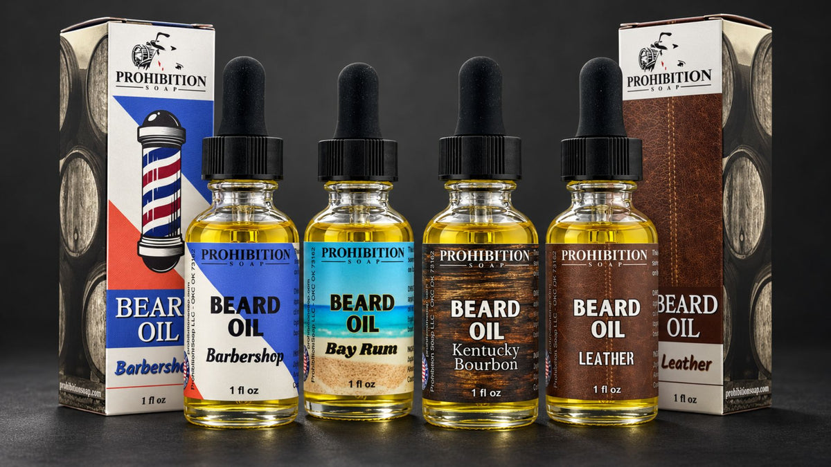Five bottles of Prohibition Labs Beard Oil with different flavor/finish labels (Barbershop, Bay Rum, Kentucky Bourbon, Leather) lined up in front of their corresponding retail boxes on a dark background.