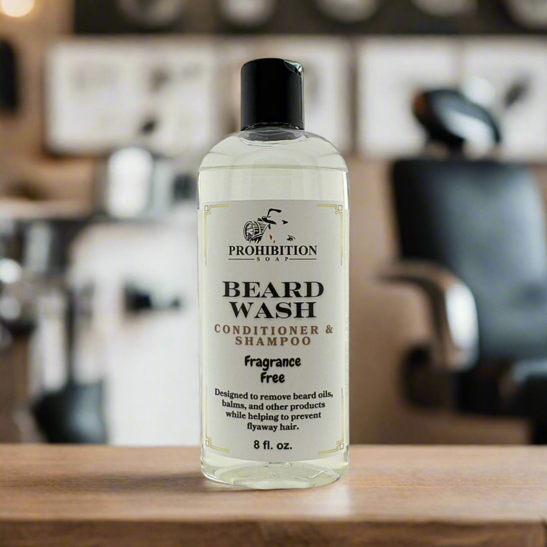 Prohibition Soap Fragrance Free Beard Wash conditioner and shampoo in clear 8 fl oz bottle with clear unscented liquid on white background, showing complete product label with directions to remove beard oils, balms and other products while preventing flyaway hair