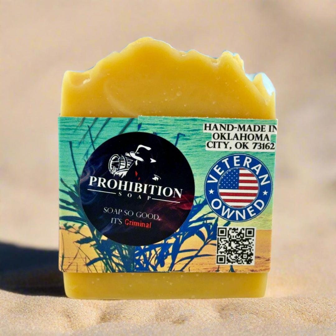 Bar of soap with a Prohibition Soap label on a sandy background