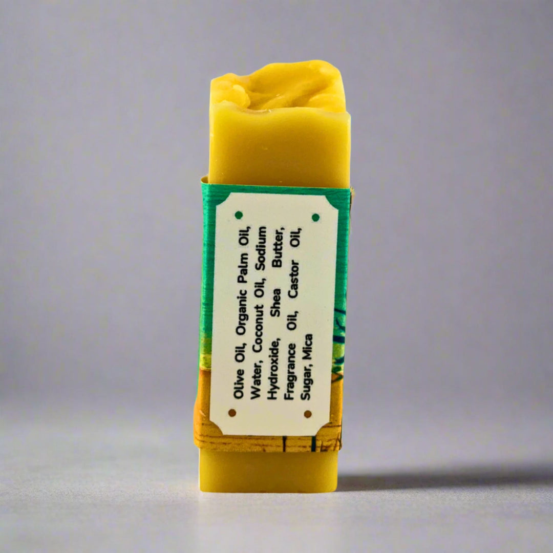 Yellow soap bar with a label on a gray background