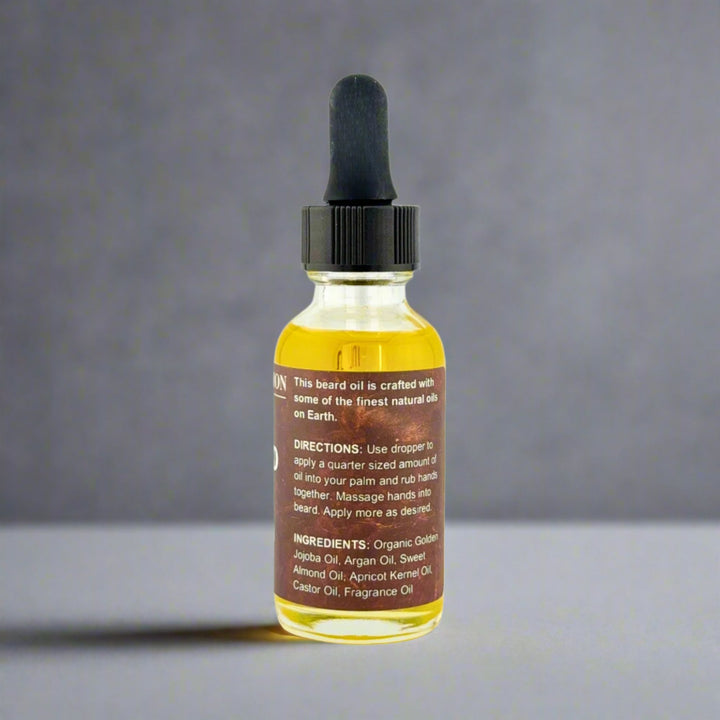 Bottle of beard oil with dropper on a gray background