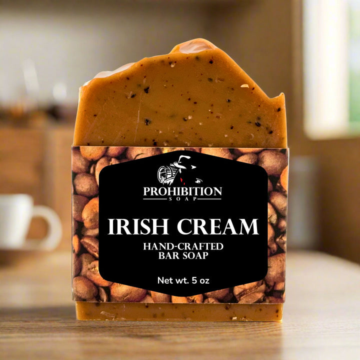 Hand-crafted bar soap labeled 'Irish Cream' by Prohibition Soap on a wooden surface.