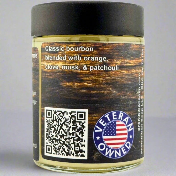 Prohibition Soap Beard Butter in Kentucky Bourbon scent - side view showing fragrance description of classic bourbon blended with orange, clove, musk, and patchouli, with QR code and Veteran Owned badge featuring American flag