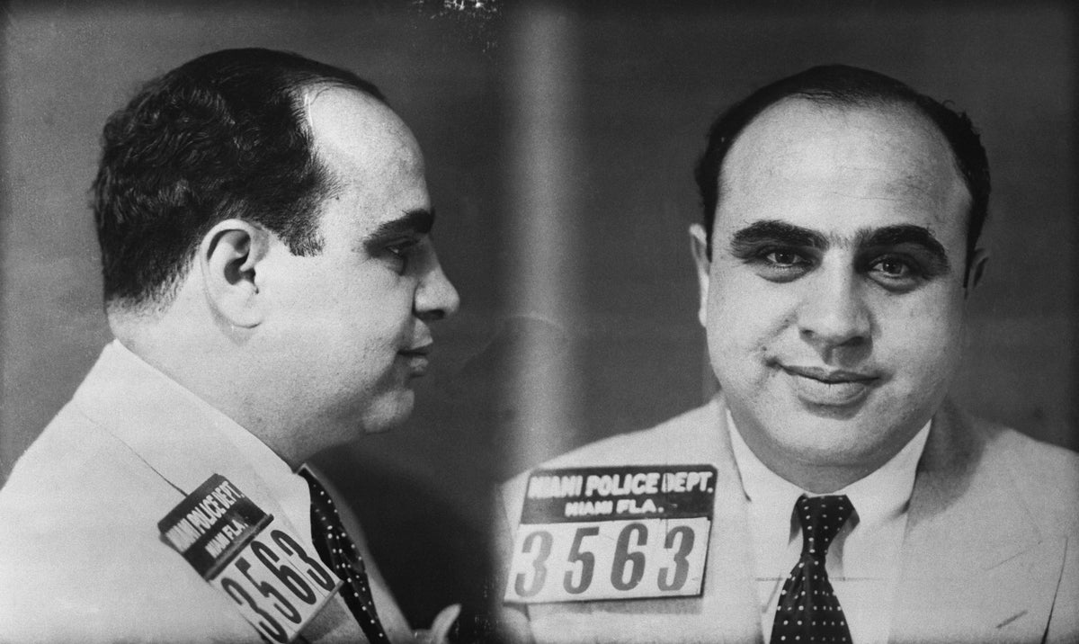 Historic 1930 police identification photo of Al Capone in Miami, with profile and front-facing portraits