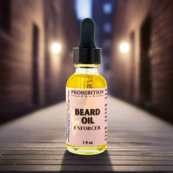 Bottle of Prohibition Soap Beard Oil Enforcer on a wooden surface with a blurred background