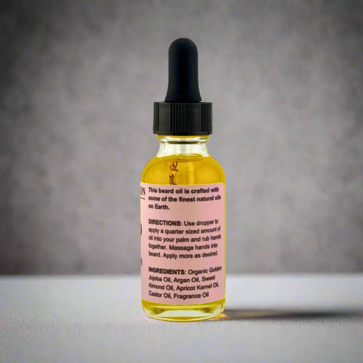 Bottle of beard oil with dropper on a gray background
