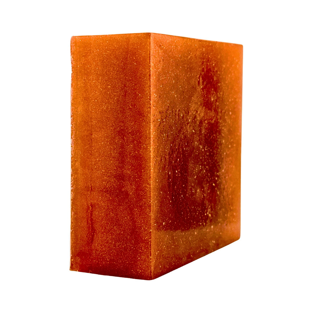 Orange cube-shaped soap on a white background
