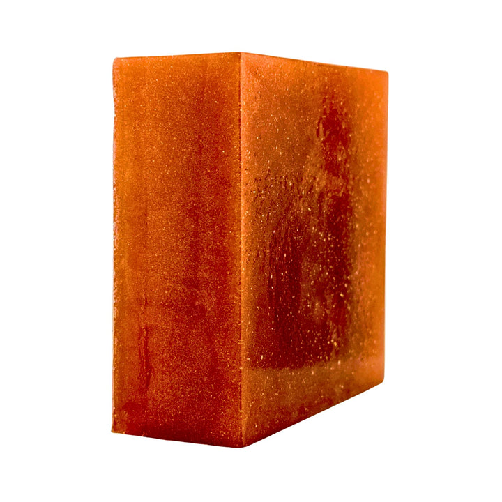 Orange cube-shaped soap on a white background