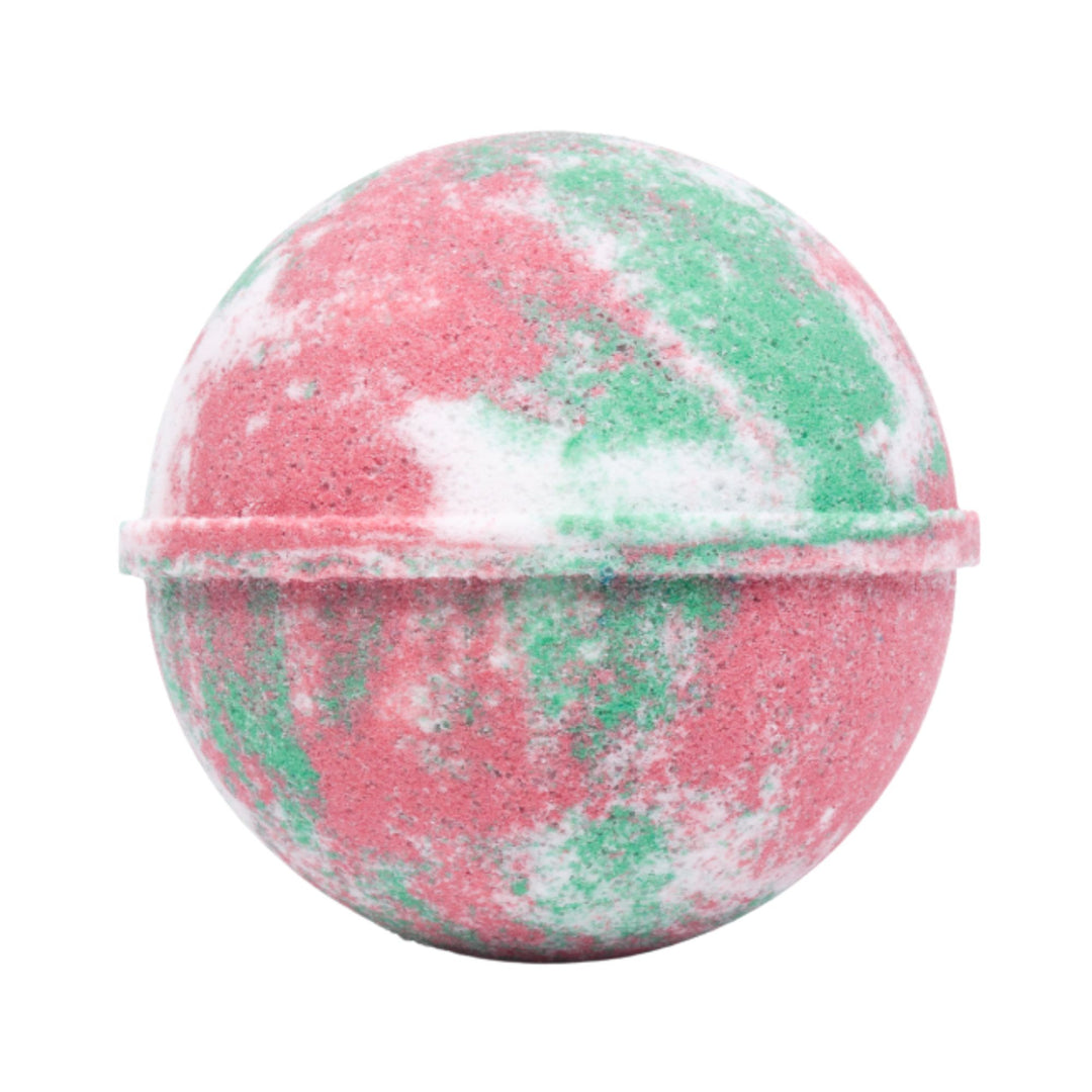 Marbled pink and green bath bomb on a white background