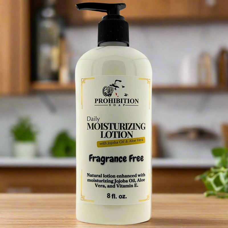 Prohibition Soap Daily Moisturizing Lotion fragrance free in 8 fl oz pump bottle with jojoba oil, aloe vera and vitamin E, photographed on wooden surface with soft kitchen background lighting
