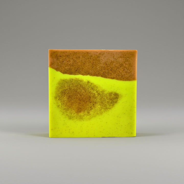 Two-tone soap with yellow and brown on a gray background