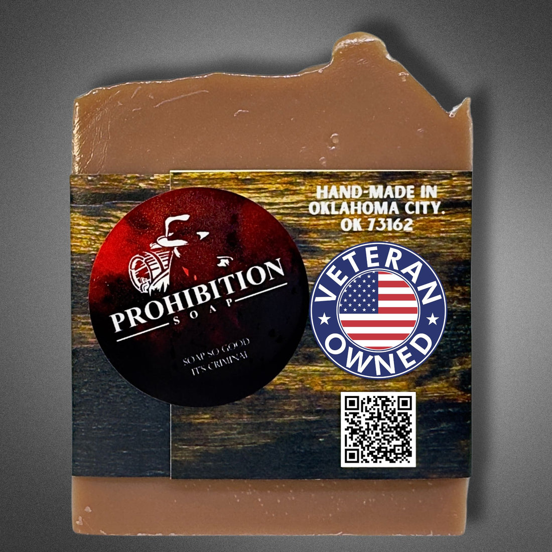 Back of Kentucky Bourbon bar soap showing the Prohibition Soap logo, Veteran Owned badge, "Hand-Made in Oklahoma City" text, and a QR code