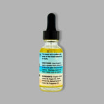Bottle of beard oil with dropper on a gray background