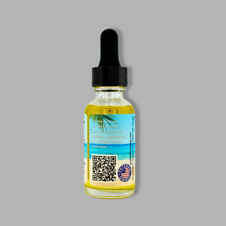 Bottle of beard oil with dropper on a gray background