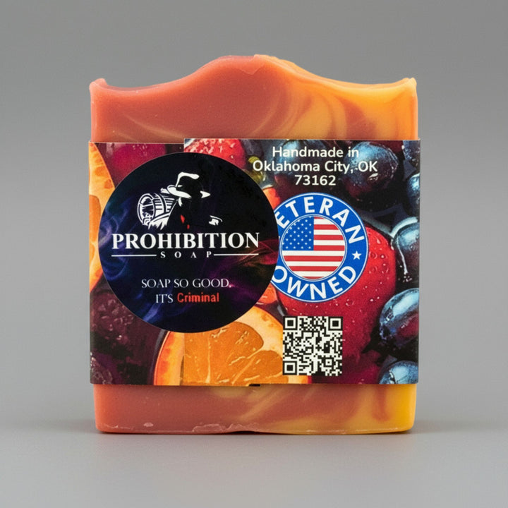 Bar of soap with a colorful label featuring the Prohibition Soap brand on a gray background.
