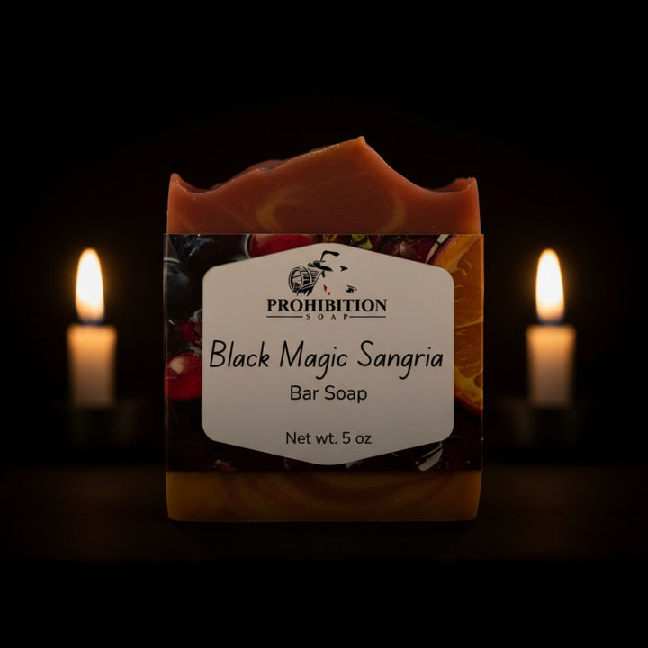 Bar soap labeled 'Black Magic Sangria' with a dark background and candles.