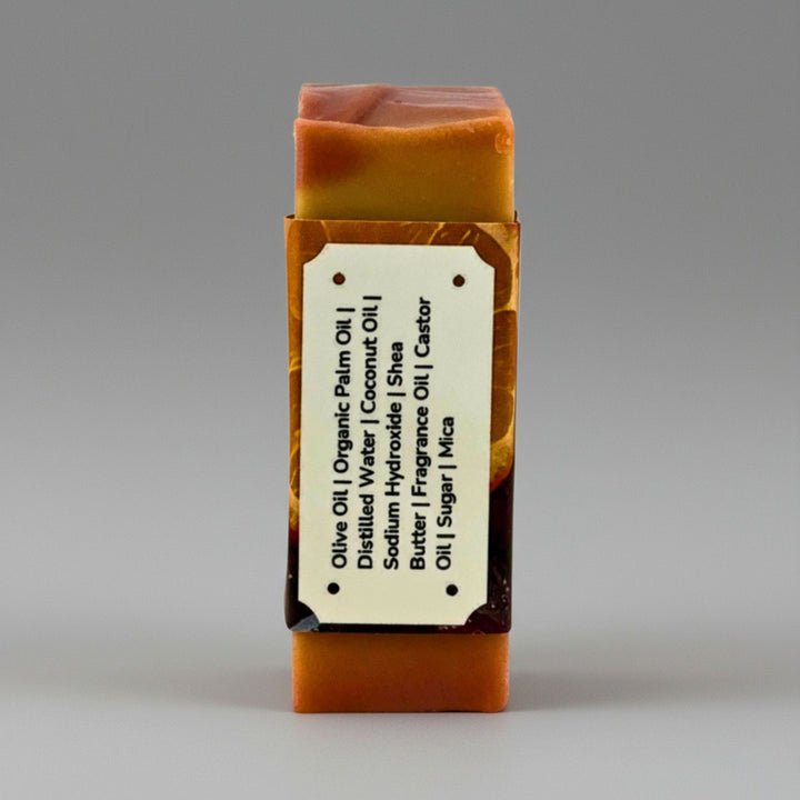 Bar of soap with a label on a gray background