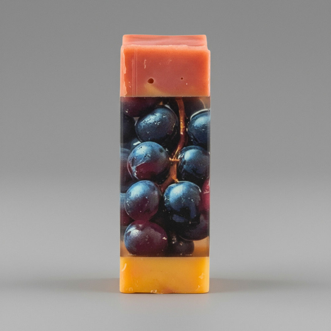 Rectangular soap bar with grape design on a gray background
