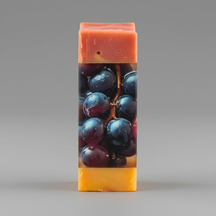 Rectangular soap bar with grape design on a gray background