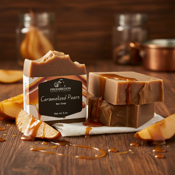 Bar of soap with 'Prohibition Soap' branding on a wooden surface with caramelized pear slices.