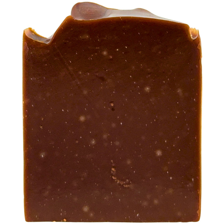 Close-up of a square piece of chocolate scented soap on a white background