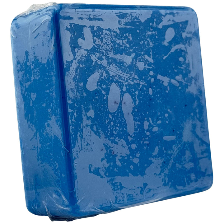 Blue rectangular soap with a textured surface on a white background