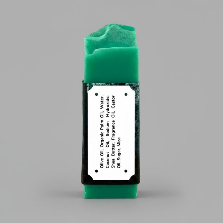 Green bar of soap with a label on a gray background