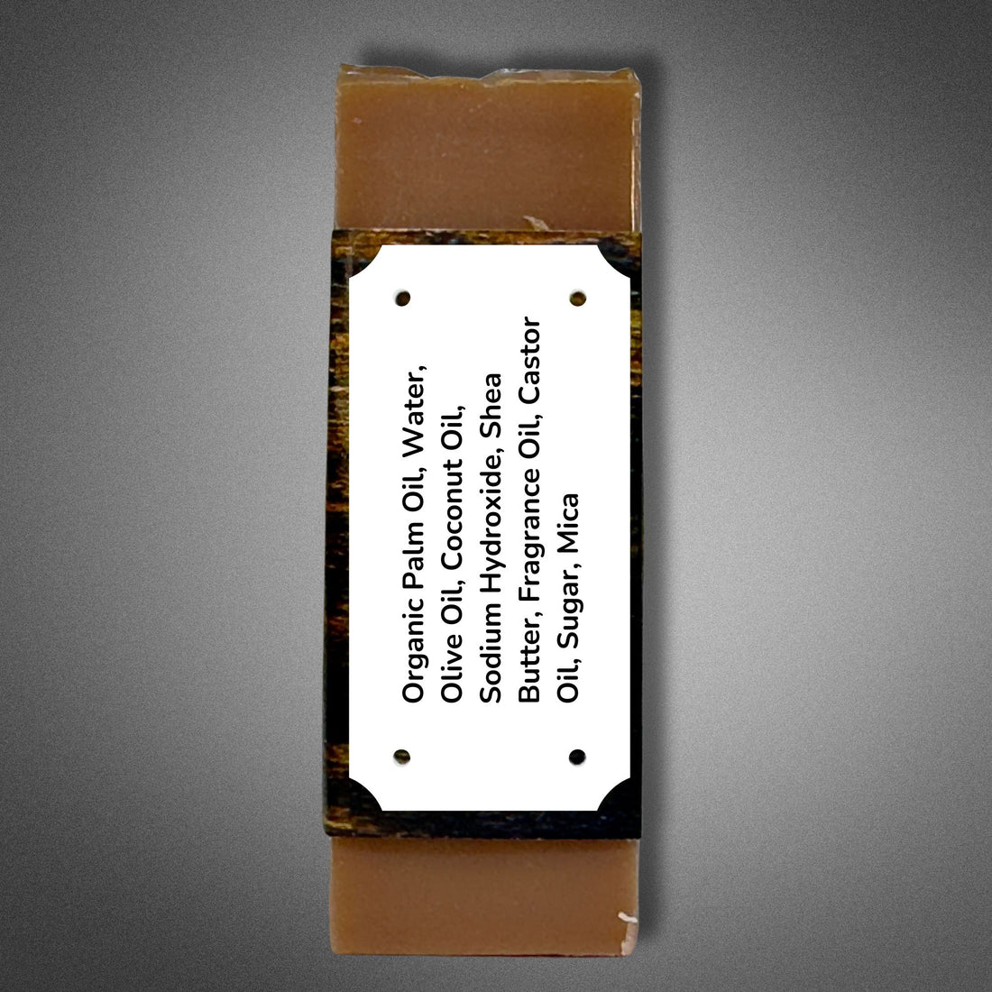 Side panel of Kentucky Bourbon soap showing the full ingredient list: Organic Palm Oil, Water, Olive Oil, Coconut Oil, Sodium Hydroxide, Shea Butter, Fragrance Oil, Castor Oil, Sugar, Mica