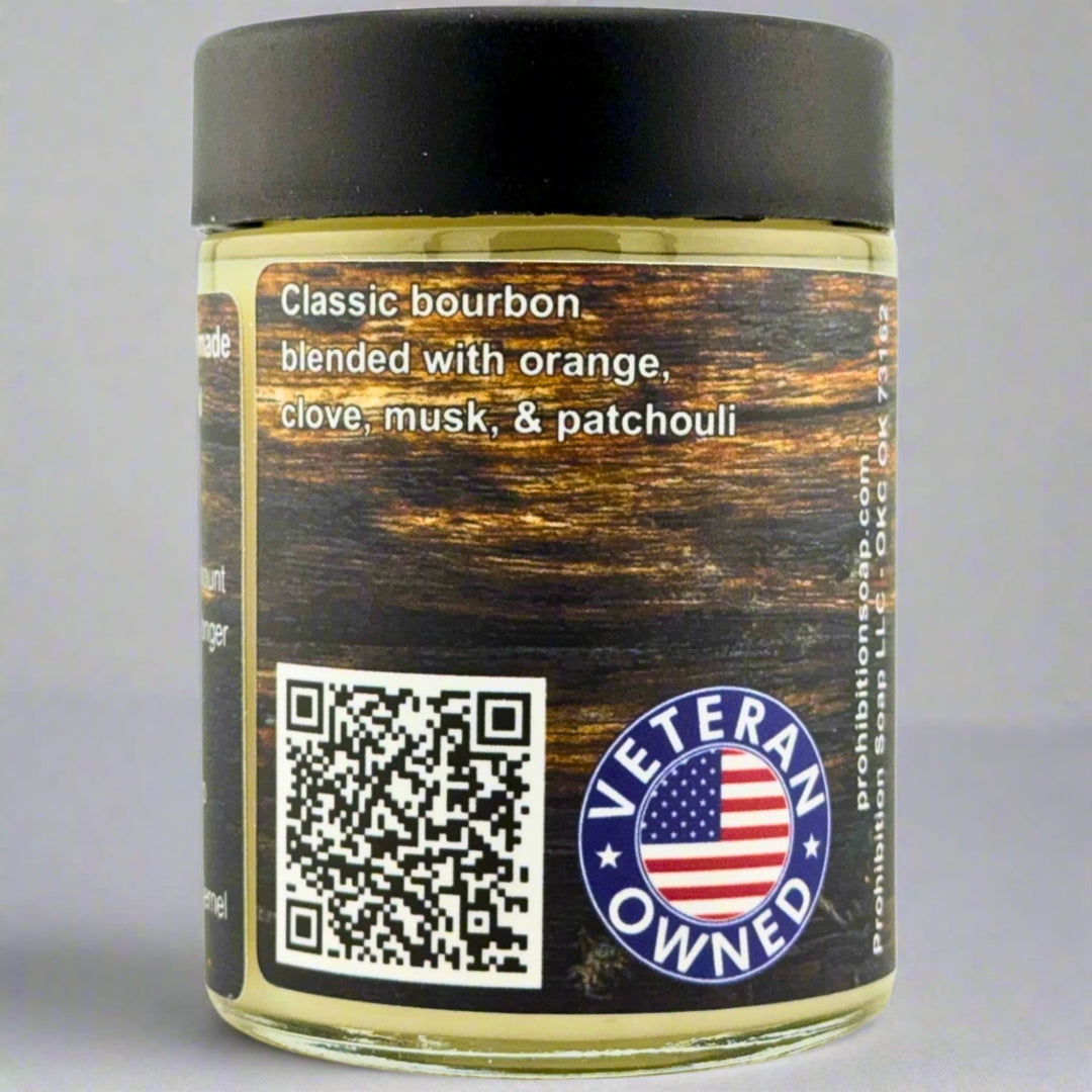 Prohibition Soap Beard Butter in Kentucky Bourbon scent - side view showing fragrance description of classic bourbon blended with orange, clove, musk, and patchouli, with QR code and Veteran Owned badge featuring American flag