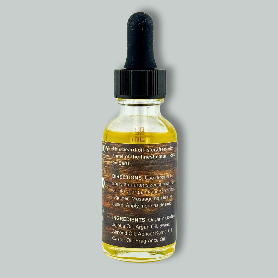 Dropper bottle of beard oil on a gray background