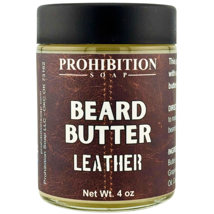 Prohibition Soap Beard Butter in Leather scent - 4 oz glass jar with black lid showing rich brown leather-textured label design and product information including directions and ingredients