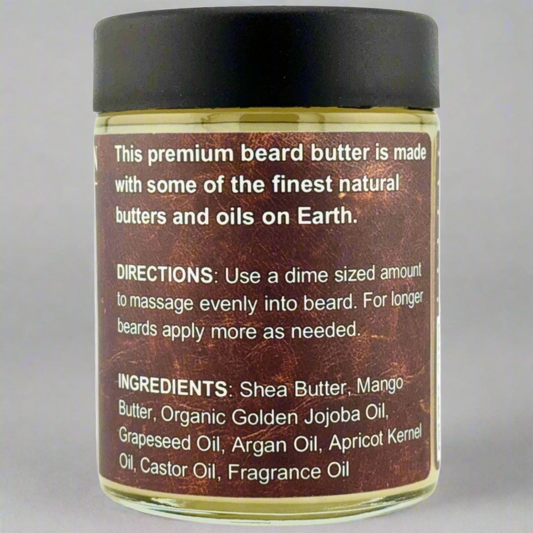 Prohibition Soap Beard Butter in Leather scent - back label showing premium quality statement, complete directions for dime-sized application, and full ingredients list including Shea Butter, Mango Butter, Organic Golden Jojoba Oil, Grapeseed Oil, Argan Oil, Apricot Kernel Oil, Castor Oil, and Fragrance Oil