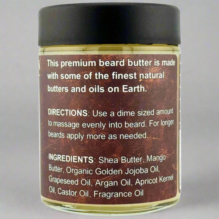 Prohibition Soap Beard Butter in Leather scent - back label showing premium quality statement, complete directions for dime-sized application, and full ingredients list including Shea Butter, Mango Butter, Organic Golden Jojoba Oil, Grapeseed Oil, Argan Oil, Apricot Kernel Oil, Castor Oil, and Fragrance Oil