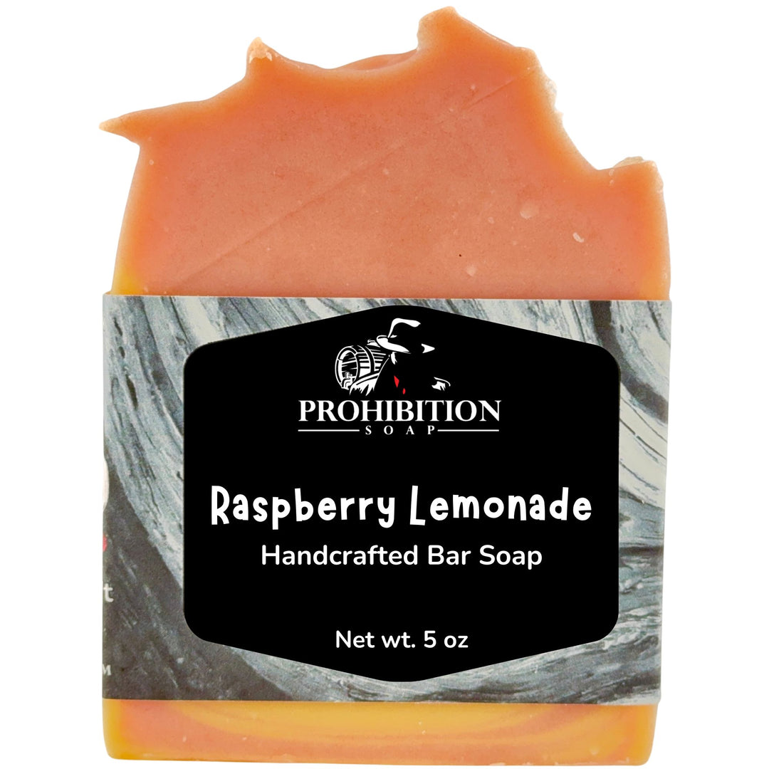 A handcrafted bar of soap with a marbled gray and white label that reads &