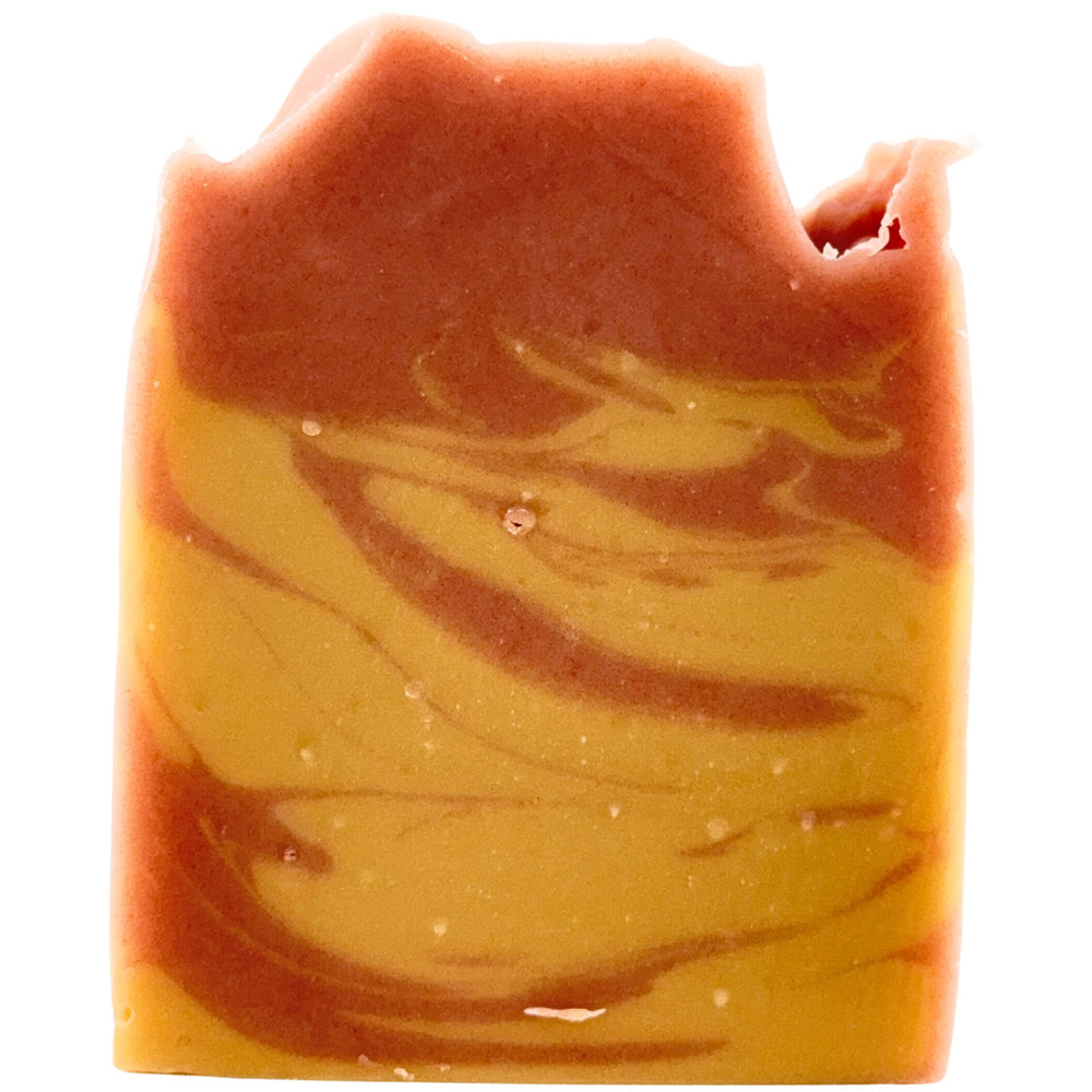 A rectangular bar of marbled artisan soap with a swirled pattern of warm orange-brown and golden yellow, isolated on a white background.