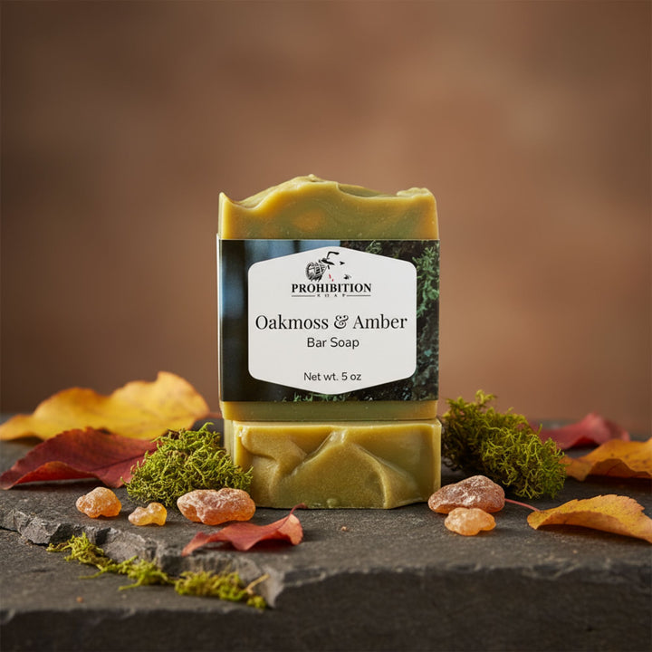 Bar of soap with 'Prohibition' label on a stone surface with autumn leaves and moss.