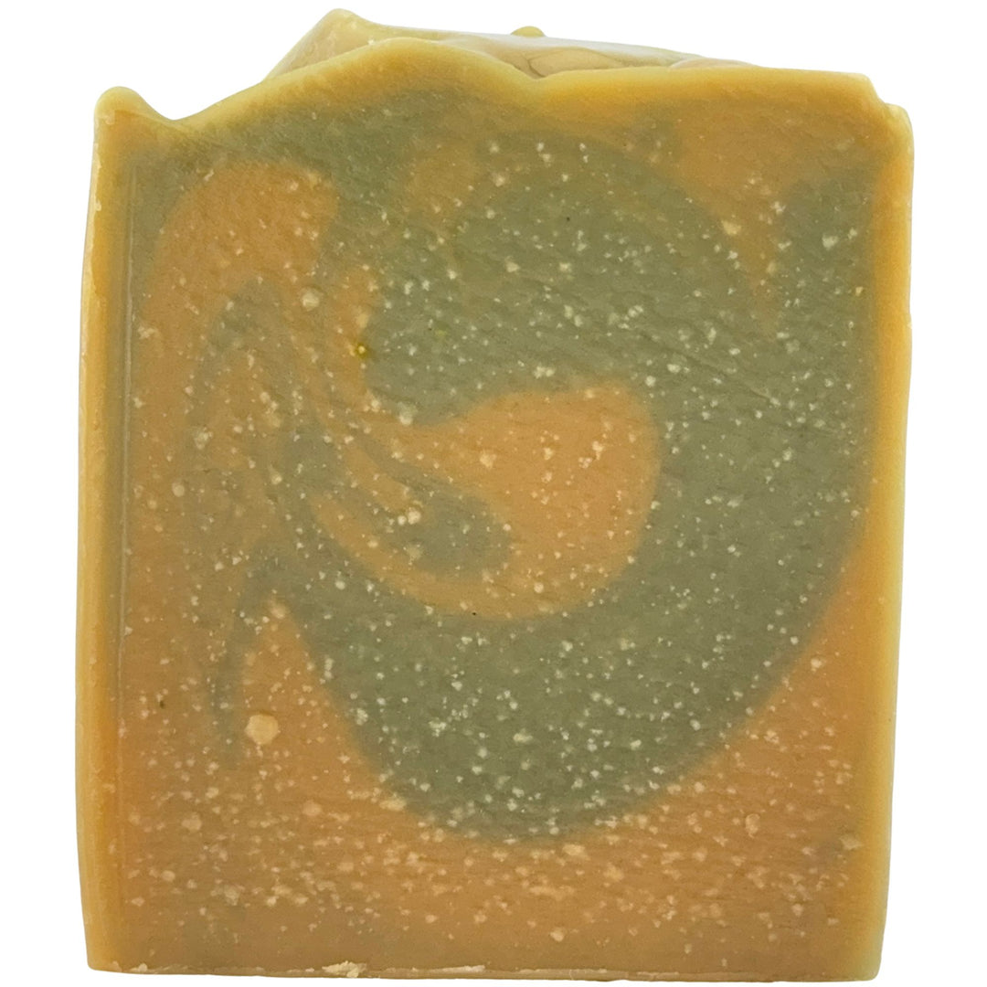 Bar of soap with green and brown swirl pattern on a white background