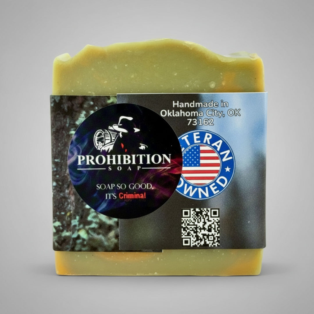 Bar of soap with a label featuring 'Prohibition Soap' branding on a gray background