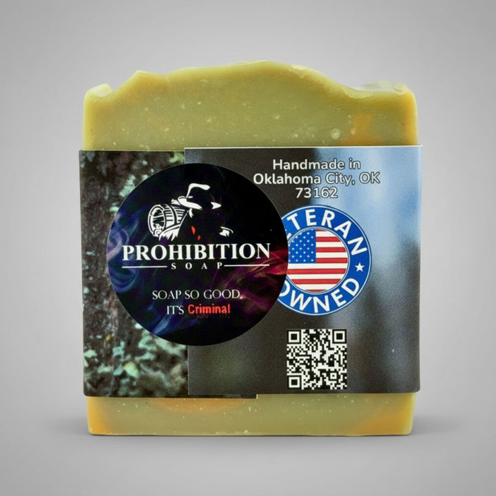 Bar of soap with a label featuring 'Prohibition Soap' branding on a gray background