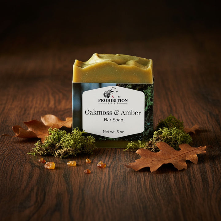 Bar of soap with 'Prohibition' branding on a wooden surface with leaves and amber stones.