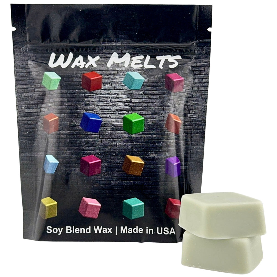 Packaging of wax melts with colorful wax cubes and a single wax cube in front.