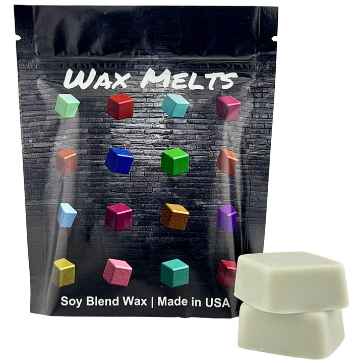 Packaging of wax melts with colorful wax cubes and a single wax cube in front.