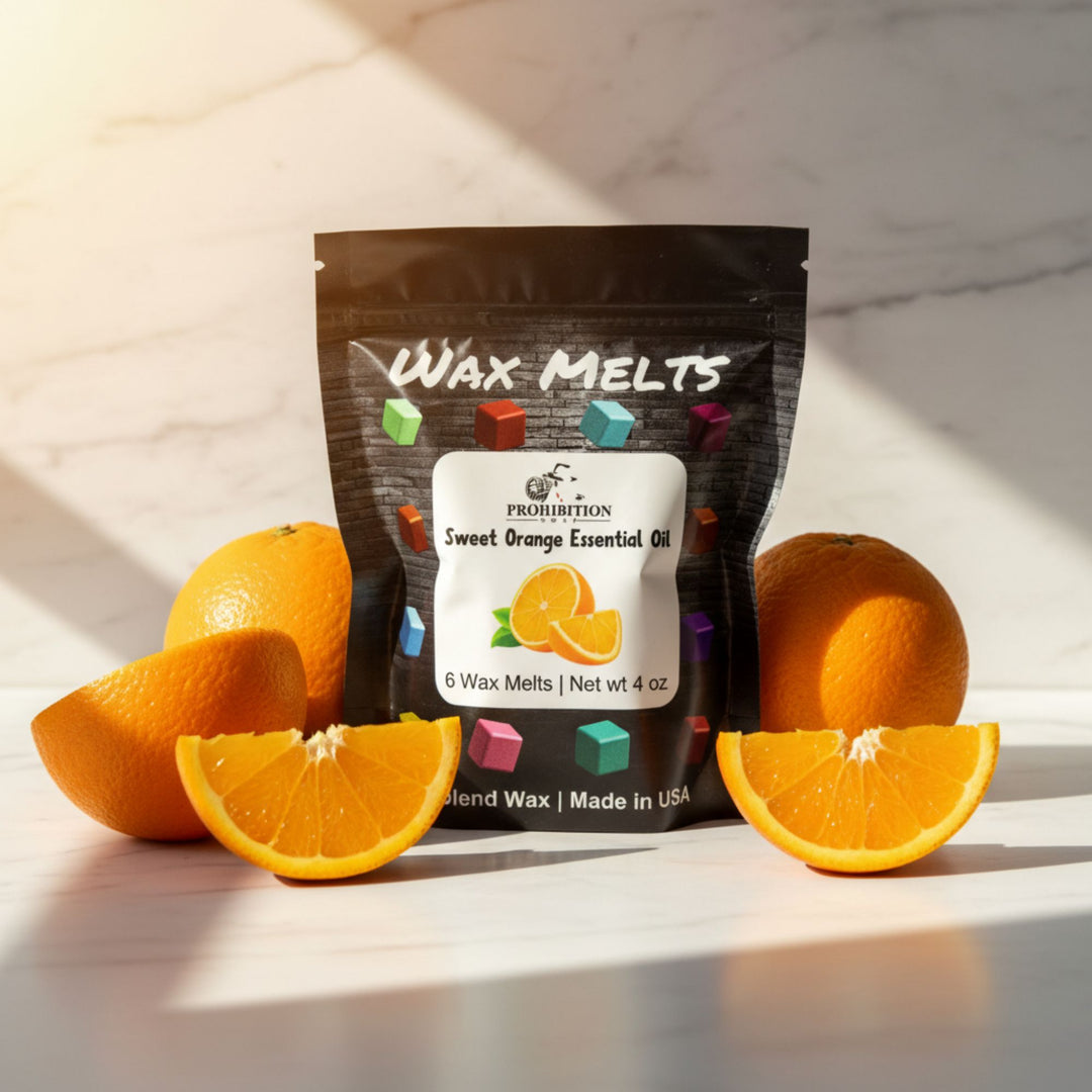 Wax melts packaging with oranges on a marble surface