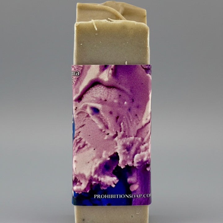 Bar of soap with a colorful label on a gray background