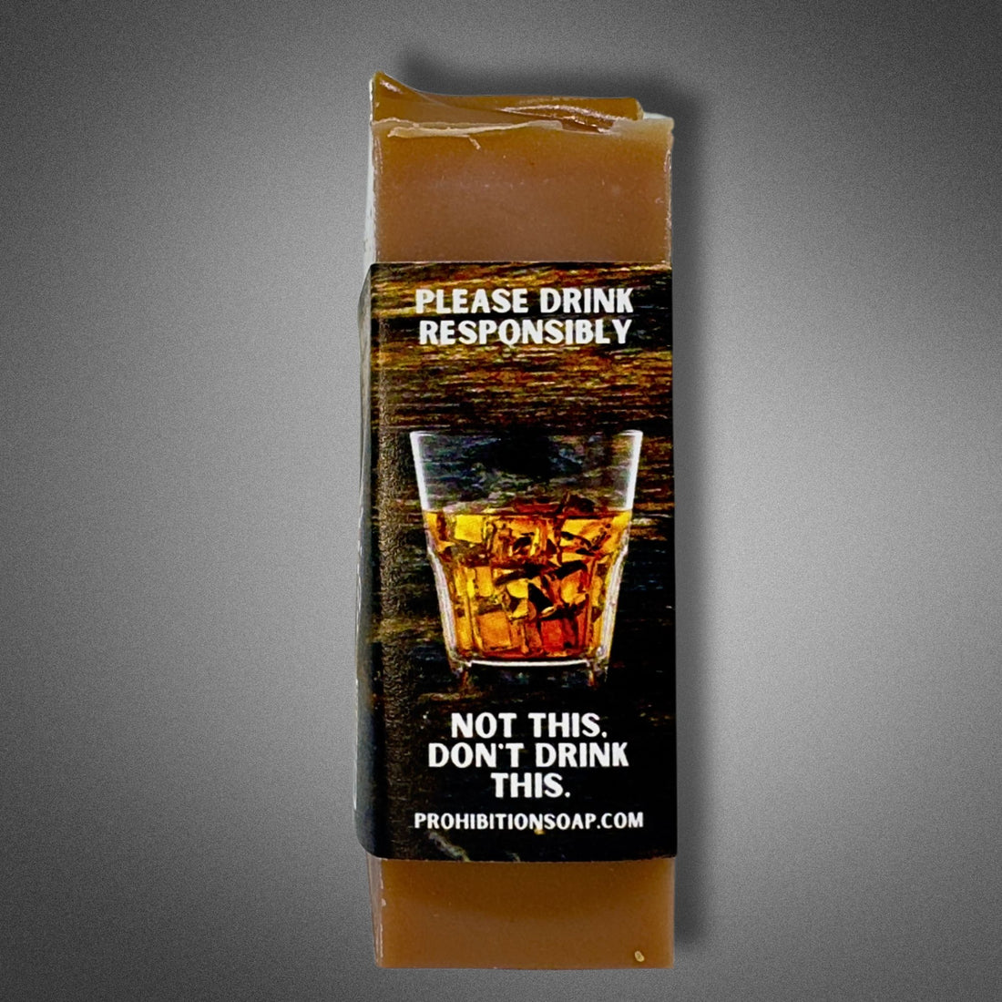 Side label of Kentucky Bourbon soap with a humorous "Please Drink Responsibly — Not This, Don't Drink This" message and a bourbon rocks glass graphic