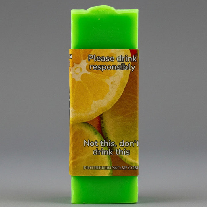 Green soap bar with a humorous label on a gray background