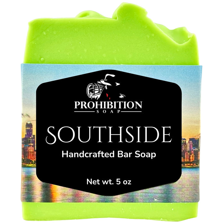 A 5 oz bar of green soap wrapped in a paper label that reads &